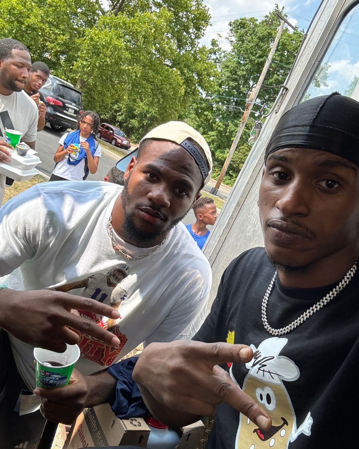 Micah Parsons at the truck with one of our team